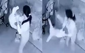 監控視頻錄下女傭阮氏段用手倒提女童雙腳搖來搖去的畫面。（圖源：視頻截圖）