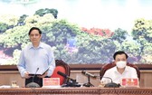 政府總理范明政（左）會上發言。（圖源：VGP）