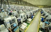 圖為太原省恬瑞工業區內的Bokwang Vina 公司的電子元件生產線一景。（圖源：越通社）