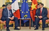 范明政總理會見法國參議院議長拉徹爾。（圖源：越通社）