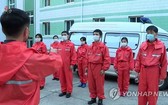 2021年12月1日，朝鮮防疫人員聽取工作部署。（圖：韓聯社）