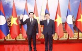 越南國會主席王廷惠和老撾國會主席賽宋蓬·豐威漢。圖自越通社