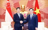 國會主席王廷惠與新加坡國 會議長陳川仁合影。