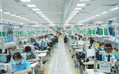 平陽省順安市同安１工業區的越南Bowker成衣有限責任公司勞工在生產。