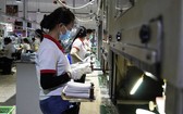 越南Ching Luh鞋類有限責任公司(隆安省濱瀝縣順道工業區)的工人。(圖源：黃南)