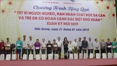 At the programme to present Tet gift packages to poor households and AO/dioxin victims in Tien Giang province (Photo: VNA)