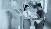 Patients are checking in a hospital using the kiosk system