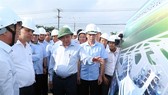 Prime Minister Nguyen Xuan Phuc inspects infrastructure construction at Loc An-Binh Son resettlement area. —VNA/VNS Photo