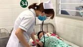 A student is treated in a hosptial in District 2 udner health insurance (Photo: SGGP)