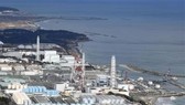 Các bể nước thải có chứa phóng xạ đã qua xử lý tại nhà máy điện hạt nhân Fukushima, Nhật Bản. Nguồn: Kyodo/TTXVN
