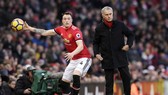 Jose Mourinho (phải) sẽ tiếp tục không mua cầu thủ trong tháng tới? Ảnh: Getty Images