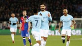 Ilkay Gundogan (giữa) mừng bàn thắng vào lưới Basel ở lượt đi vòng 1/8. Ảnh: Getty Images