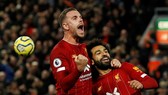 Những người hùng Jordan Henderson và Mohamed Salah ăn mừng. Ảnh: Getty Images