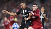 Kylian Mbappe (trái) từng đối đầu Liverpol ở Champions League. Ảnh: Getty Images