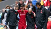 HLV Jurgen Klopp quan tâm đến tình hình chấn thương của Andy Robertson. Ảnh: Getty Images