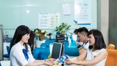 Giao dịch tại CBBank. Ảnh: HUY ANH
