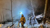 Hiện trường vụ máy bay vận tải An-12 rơi ở vùng Irkutsk, phía Đông Siberia của Nga. Ảnh: REUTERS