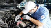 Công tác kiểm tra, giám định ô tô tại Trạm đăng kiểm 29-03S, Hà Nội. Ảnh: QUANG PHÚC