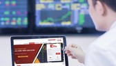 Nhà đầu tư theo dõi diễn biến thị trường chứng khoán. Ảnh: HUY PHAN