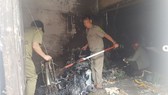Lực lượng khám nghiệm hiện trường 1 vụ phóng hoả trước đó