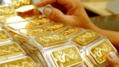 Gold devalues by nearly VND1 million per tael after God of Wealth Day