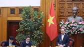 Prime Minister Nguyen Xuan Phuc chairs an urgent meeting on January 27 to discuss measures against the acute respiratory disease caused by the novel coronavirus (nCoV) (Photo: VNA)