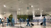 Passengers arrive at Noi Bai Airport.