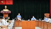Deputy PM Vu Duc Dam chairs a working session on Covid-19 prevention and control activities with HCMC and relevant departments on July 20. (Photo: SGGP)