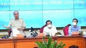 State President Nguyen Xuan Phuc speaks at the meeting. (Photo: SGGP)