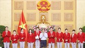 Thủ tướng Chính phủ Phạm Minh Chính động viên các tuyển thủ VIệt Nam trước khi lên đường tham dự Olympic Tokyo 2020. Ảnh: TTXVN