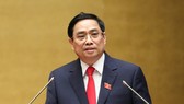Thủ tướng Chính phủ Phạm Minh Chính trình bày Tờ trình về cơ cấu số lượng thành viên Chính phủ khóa XV. Ảnh: QUANG PHÚC