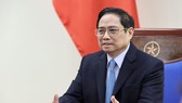 Thủ tướng Phạm Minh Chính điện đàm với Thủ tướng Trung Quốc. Ảnh: VIẾT CHUNG