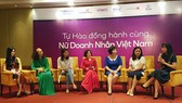 Vietnamese businesswomen are discussing the project DevelopHer at its introduction on June 14 in Hanoi. Photo by Tran Binh