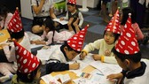 Children draw pictures at the event (Source: organising board)Children draw pictures at the event (Source: organising board)