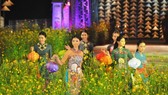 Girls wearing áo dài at a costume show in Hue. VNS Photo Phuoc Buu
