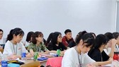Students of a high-quality program in the University of Economics and Law (Vietnam National University HCMC) in their theory lesson. (Photo: SGGP)