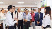 A representative of the Municipal Department of Information and Communications welcomes the Myanmar press delegation at  Ho Chi Minh City Press Center