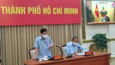 Đồng chí Trương Hòa Bình, Phó Thủ tướng Thường trực Chính phủ và Chủ tịch UBND TPHCM Nguyễn Thành Phong tại điểm cầu TPHCM
