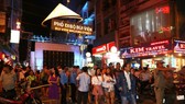 Visitors at Bui Vien walking street which was officially opened in HCMC on August 20 (Photo: SGGP)