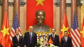 The signing ceremony took place in the presence of President of Việt Nam Tran Dai Quang and President of the US Donald Trump, within the framework of the US President’s official state visit to Vietnam. (Photo: VNA)
