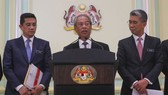 In a photo taken on March 16, 2020, Prime Minister Muhyiddin Yassin (centre) speaks during a press conference at the Prime Minister Office in Putrajaya, Malaysia. (Photo: straitstimes.com)