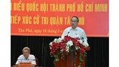 Secretary of HCMC Party Committee Nguyen Thien Nhan makes a statement at the meeting with deputies in Tan Phu District on May 16 (Photo: SGGP)