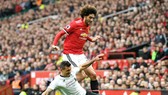 Marouane Fellaini trong lần đối đầu Liverpool hồi tháng 3. Ảnh: Getty Images    