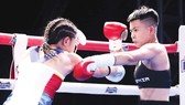 Võ sĩ Nguyễn Thị Thu Nhi (phải). Ảnh: P.NGUYỄN