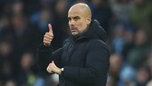HLV Pep Guardiola khẳng định đang hạnh phúc ở Man.City. Ảnh: Getty Images
