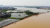 Nước sông tràn bờ do mưa lớn tại tỉnh Giang Tây, Trung Quốc. Ảnh: THX/TTXVN