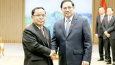 Thủ tướng Phạm Minh Chính tiếp  đồng chí Khamphan Phommathat. Ảnh: TTXVN