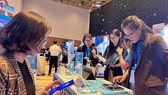 Tìm hiểu các ứng dụng chuyển đổi số tại Ngày hội Khởi nghiệp đổi mới sáng tạo 2022 ở TPHCM. Ảnh: T. BA