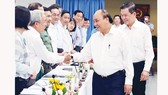 Chủ tịch nước Nguyễn Xuân Phúc với các đại biểu dự buổi làm việc. Ảnh: TTXVN