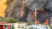 Australia: Hàng ngàn người bị mắc kẹt do cháy rừng